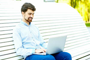 Happy user browsing a website, indicating high user satisfaction.